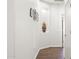 Hallway with wood flooring and a decorative niche at 18137 N Plaza Ct, Surprise, AZ 85374