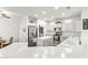 Bright kitchen features stainless steel appliances, an island, and white countertops at 18137 N Plaza Ct, Surprise, AZ 85374