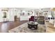 Open-concept living space with dining area and kitchen featuring lots of natural light at 18137 N Plaza Ct, Surprise, AZ 85374