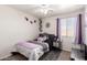 Comfortable bedroom featuring modern decor, carpet, and a ceiling fan at 18850 N 16Th Pl, Phoenix, AZ 85024