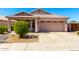 Inviting exterior showcases a well-manicured lawn and attached two-car garage at 18850 N 16Th Pl, Phoenix, AZ 85024