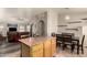 Open-concept kitchen with an island, dining area and connection to the living room at 18850 N 16Th Pl, Phoenix, AZ 85024