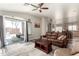 Open living room with a sliding glass doors to patio and modern decor at 18850 N 16Th Pl, Phoenix, AZ 85024