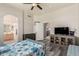 A main bedroom features wood-look floors with connecting views to a bathroom and hallway at 18850 N 16Th Pl, Phoenix, AZ 85024