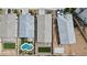 Aerial view of homes showcasing backyard layouts, including pools, patios, and landscaping at 1924 S 82Nd Cir, Mesa, AZ 85209