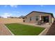 Spacious backyard with lush artificial grass, perfect for outdoor entertaining and relaxation at 1924 S 82Nd Cir, Mesa, AZ 85209