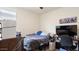 Bedroom with medium-toned floors, a playstation and a wooden desk at 1924 S 82Nd Cir, Mesa, AZ 85209