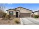 Lovely residence featuring desert landscaping, a two-car garage, and a welcoming entrance at 1924 S 82Nd Cir, Mesa, AZ 85209