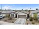 Charming single-story home with a two-car garage and low maintenance desert landscaping in front yard at 1924 S 82Nd Cir, Mesa, AZ 85209