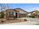 Beautifully kept home with a two-car garage, low-maintenance desert landscaping, and a neat front yard at 1924 S 82Nd Cir, Mesa, AZ 85209