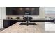 Modern kitchen featuring dark cabinetry, granite countertops, stainless steel appliances, and a center island at 1924 S 82Nd Cir, Mesa, AZ 85209
