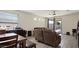 Open-concept living room with ceiling fan, neutral paint, and sliding doors to the backyard patio at 1924 S 82Nd Cir, Mesa, AZ 85209