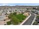 Scenic neighborhood with well-maintained lawns, mature trees, and community parks at 1924 S 82Nd Cir, Mesa, AZ 85209
