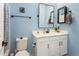 Charming bathroom featuring a vanity with a mirror and a toilet at 2169 N 212Th Ln, Buckeye, AZ 85396