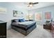 Stylish bedroom with light blue walls, ceiling fan, and carpet flooring at 2169 N 212Th Ln, Buckeye, AZ 85396