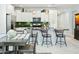 Bright, well-appointed kitchen with a central island, stainless steel appliances, and ample counter space for cooking at 2169 N 212Th Ln, Buckeye, AZ 85396