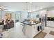 Spacious and open floor plan showcasing the modern kitchen, cozy living area, and stylish dining space at 2169 N 212Th Ln, Buckeye, AZ 85396