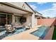 Covered patio with outdoor seating and a view of the pool area at 2169 N 212Th Ln, Buckeye, AZ 85396