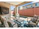 Inviting covered patio with comfortable seating and a view of the sparkling pool at 2169 N 212Th Ln, Buckeye, AZ 85396