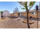 Open backyard featuring gravel landscaping, a storage shed, and a small patio area at 2581 E Commonwealth Cir, Chandler, AZ 85225