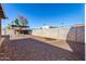Backyard with gravel, privacy wall, and a shade tree at 2581 E Commonwealth Cir, Chandler, AZ 85225