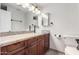 Bathroom showcasing a modern vanity with granite countertops and stylish fixtures at 2581 E Commonwealth Cir, Chandler, AZ 85225