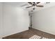 Bedroom with plush carpet, white walls, ceiling fan and a closet door for storage at 2581 E Commonwealth Cir, Chandler, AZ 85225