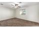 Carpeted bedroom with fan and natural light at 2581 E Commonwealth Cir, Chandler, AZ 85225