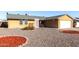 Charming single-story home with a two-car garage and low maintenance desert landscaping at 2581 E Commonwealth Cir, Chandler, AZ 85225