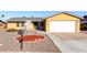 Charming single-story home featuring a two-car garage and low maintenance desert landscaping at 2581 E Commonwealth Cir, Chandler, AZ 85225