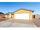 Charming single-story home featuring a two-car garage and low maintenance desert landscaping at 2581 E Commonwealth Cir, Chandler, AZ 85225