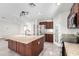 Bright kitchen with a large island, stainless steel appliances, and a pantry at 2581 E Commonwealth Cir, Chandler, AZ 85225
