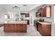 Modern kitchen featuring granite countertops, stainless steel appliances, and a central island with a sink at 2581 E Commonwealth Cir, Chandler, AZ 85225