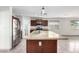 Bright kitchen with granite countertops, stainless steel appliances, and a large island with a sink at 2581 E Commonwealth Cir, Chandler, AZ 85225