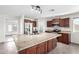Spacious kitchen featuring granite counters, stainless appliances, and an island with a sink and storage at 2581 E Commonwealth Cir, Chandler, AZ 85225