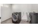 Well-equipped laundry room featuring modern appliances and tile flooring at 2581 E Commonwealth Cir, Chandler, AZ 85225