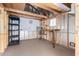 Interior of a storage shed with pegboard walls, shelving, and workbench area at 2581 E Commonwealth Cir, Chandler, AZ 85225