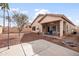 Backyard features a covered patio, mature trees, gravel landscaping and a built-in barbecue at 28321 N Zircon Dr, San Tan Valley, AZ 85143