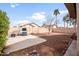 Backyard features include a built in barbecue, mature trees and gravel landscaping at 28321 N Zircon Dr, San Tan Valley, AZ 85143