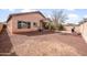 Backyard features include gravel landscaping, a built-in barbecue, patio and mature trees at 28321 N Zircon Dr, San Tan Valley, AZ 85143