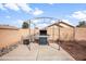Backyard features a built-in barbecue, gravel landscaping and mature trees at 28321 N Zircon Dr, San Tan Valley, AZ 85143