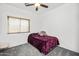 Bedroom features include neutral gray carpet and a window providing natural light at 28321 N Zircon Dr, San Tan Valley, AZ 85143