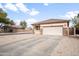 Inviting single-story residence with a neutral color palette, a two-car garage, and desert landscaping at 28321 N Zircon Dr, San Tan Valley, AZ 85143