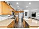 Well-lit kitchen with stainless steel appliances, a kitchen island, and plenty of cabinets at 28321 N Zircon Dr, San Tan Valley, AZ 85143