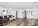 A spacious living room featuring modern decor, hardwood floors, and ample natural light at 28321 N Zircon Dr, San Tan Valley, AZ 85143