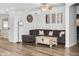 Comfortable living room featuring a large sectional sofa, a wooden coffee table, and modern wall art at 28321 N Zircon Dr, San Tan Valley, AZ 85143