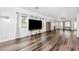 Bright and airy living room with large windows, hardwood floors, and a neutral color scheme at 28321 N Zircon Dr, San Tan Valley, AZ 85143