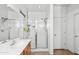 Main bathroom featuring a walk-in shower with glass doors, a sink, and tile flooring at 28321 N Zircon Dr, San Tan Valley, AZ 85143