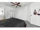Large main bedroom with a ceiling fan, neutral carpet, and access to the main bathroom at 28321 N Zircon Dr, San Tan Valley, AZ 85143