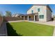 Beautiful backyard featuring a well-maintained lawn and a covered patio area at 2943 W Thorn Tree Dr, Phoenix, AZ 85085